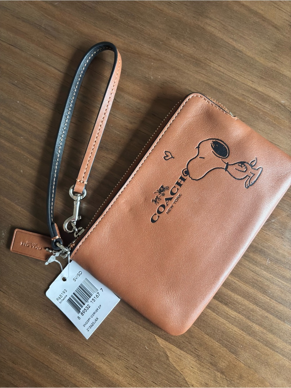 Coach x Peanuts brown leather wristlet